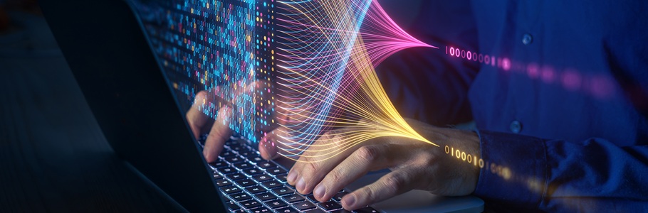 Hands typing on a laptop.