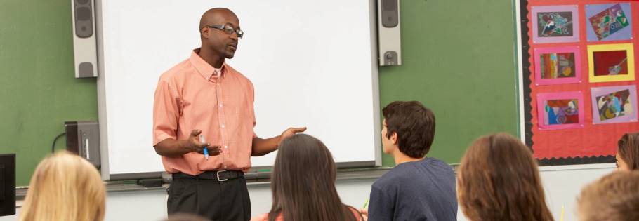 Image of a teacher speaking to students