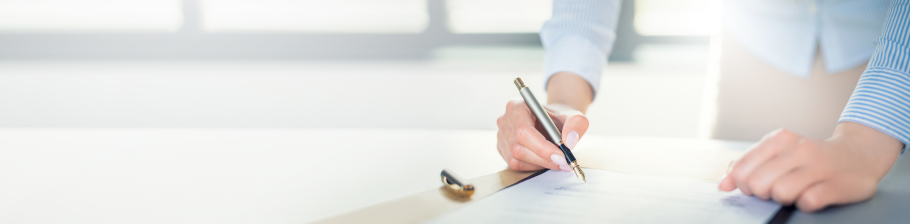 Image of a teacher completing a monitoring form