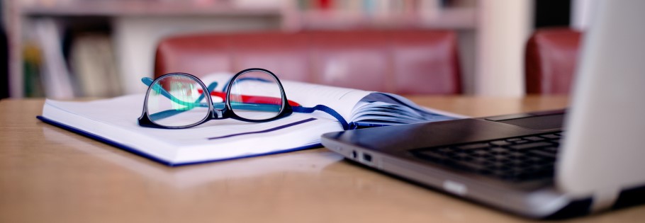 Image of a desk and a laptop