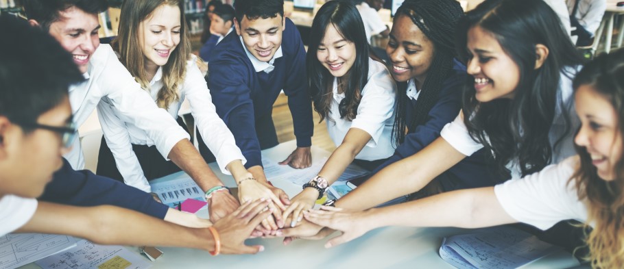 Image of a group of students in a classroom discussing student support