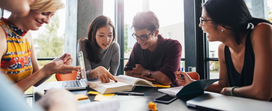 Image of a teacher chatting to students about university