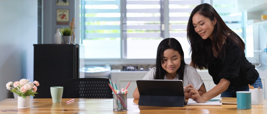 Image of a student and teacher looking at course options