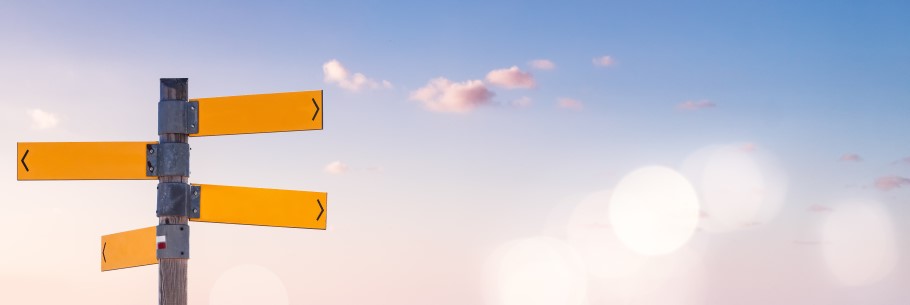 Image of a road sign pointing in different directions