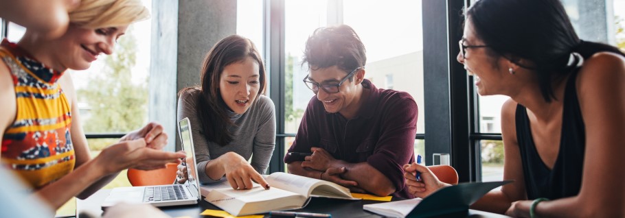 An image of students chatting with a university regional specialist.