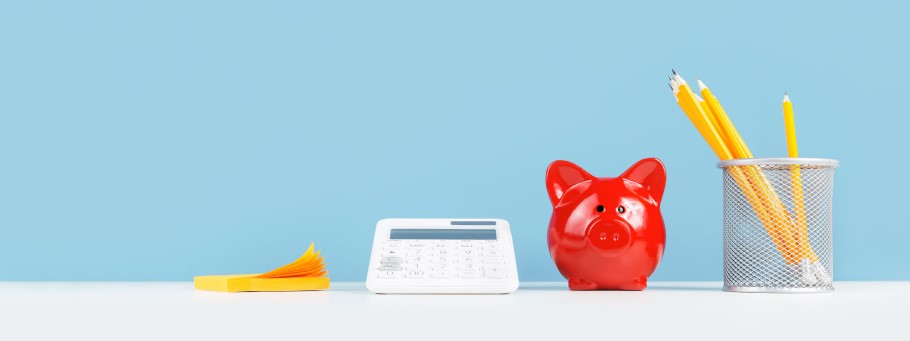 An image of a desk with a money box