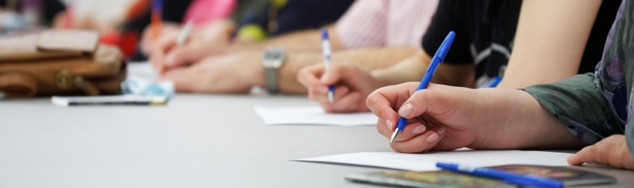 Image of a student in a class working on their university application