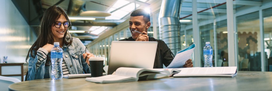 Image of two students chatting at a university