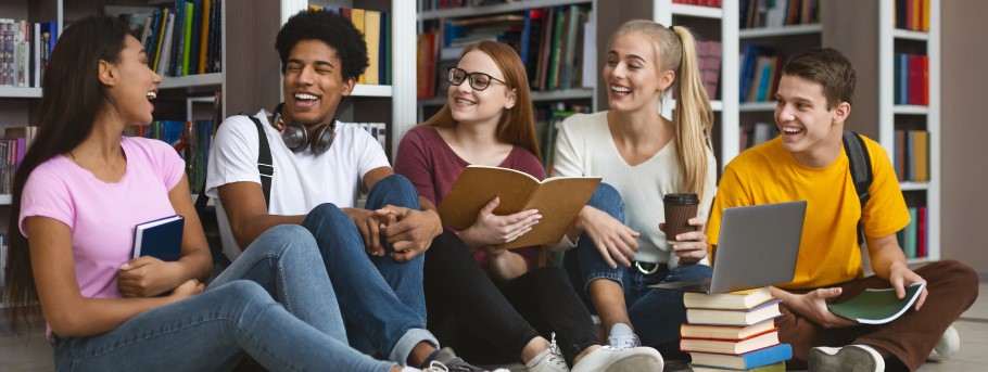 Image of a group of students chatting at a university fair